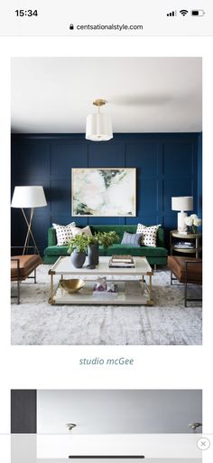 an image of a living room with blue walls and white carpet, including a green couch