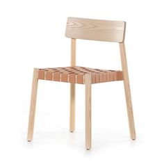 a wooden chair sitting on top of a white floor