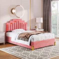 a bed with pink headboard and foot board in a white room next to a window