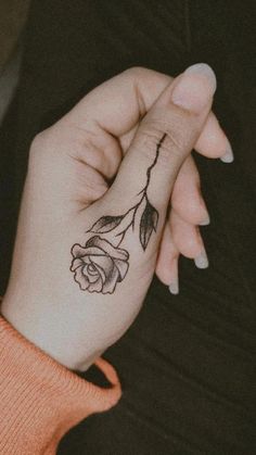 Rose Tattoo Designs Female Rose Hand Tattoo, Rose Tattoo On Side Of Hand, Rose Tattoo Design On Hand, Roses Finger Tattoo, Rose Tattoos On Finger, Rose On Thumb Tattoo, Small Rose Tattoo Finger, Rose On Finger Tattoo