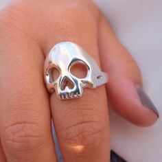 A cool unisex skull ring made of 925 sterling silver. Each piece is made by hand in my workshop in Hatton Garden, London. Much care and attention goes into creating each ring. If you don't know your UK ring size, please send me a message with your ring size and I will make it. Example Swedish ring size, EU, US, German, France etc. Finish: polished Width: Skull: 19mm, shank: 4mmThickness: 2 - 2.5mm  I spend a lot of time putting care and attention into each piece so you can rest assured you will Sterling Silver Skull Print Rings As Gift, Skull Shaped 925 Silver Ring Gift, 925 Silver Skull Ring Gift, Gift Skull Ring Stamped 925, Sterling Silver Rings With Skull Print For Gift, Sterling Silver Skull Ring Gift, Silver Nickel-free Skull Ring As Gift, Hand Cast Sterling Silver Skull Ring, Unique Silver Skull Ring Hallmarked