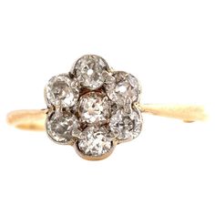 an old mine cut diamond cluster ring in yellow gold and white diamonds, circa 1920's