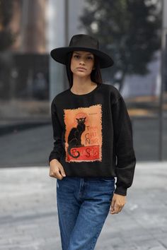 Embrace the vintage Parisian vibe with this Le Chat Noir sweatshirt featuring a stunning poster design by Théophile Alexandre Steinlen. Made with a cozy medium-heavy fabric blend of cotton and polyester, this classic fit crewneck sweatshirt offers comfort and durability. Perfect for those who appreciate French art and cat lovers, this sweatshirt is ideal for casual wear during the colder months or as a unique gift for special occasions like birthdays or Christmas. Product features - Made with a Vintage Parisian, Parisian Vibes, French Poster, Cat Sweater, French Art, Vintage Sweatshirt, Heavy Fabric, Classic Black, Black Cat