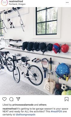 several bicycles and helmets are hanging on the wall