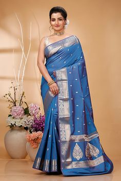 Elevate your ethnic wardrobe with this Exquisite Handwoven Banarasi Saree, a masterpiece of traditional Indian craftsmanship. Made from premium quality silk, this saree features intricate Zari work that showcases the rich cultural heritage of Banaras. Perfect for weddings, festivals, and special occasions, this Banarasi saree exudes elegance and sophistication. Each saree is meticulously handcrafted by skilled artisans, ensuring that every piece is unique and of the highest quality. The luxuriou Banarasi Saree, Zari Work, Satin Silk, Draped Fabric, Banarasi Sarees, Pure Silk Sarees, Traditional Indian, Cultural Heritage, Blouse Piece