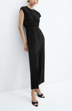 Narrow pleats add plenty of texture and modern poise to a cap-sleeve jumpsuit complete with a matching tie belt. Back keyhole with button-and-loop closure Jewel neck Cap sleeves Removable tie belt Unlined 100% polyester Machine wash, line dry Imported Black High-waist Cotton Jumpsuits And Rompers, Formal V-neck Belted Jumpsuit, Black High Stretch V-neck Jumpsuits And Rompers, Black V-neck Jumpsuits And Rompers With Pockets, Solid V-neck Belted Jumpsuit, Pleated Jumpsuit, Belt Tying, Jumpsuit With Sleeves, Jewel Neck