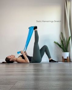 a woman is doing exercises on the floor with a yoga mat and water bottle in her hand