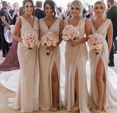 the bridesmaids are all dressed in beige dresses and holding their bouquets together