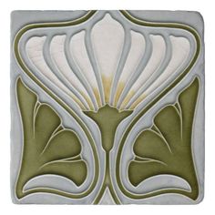 an art deco tile design in green and white