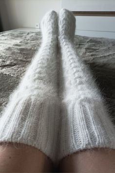 High socks are knitted from angora with the addition of nylon (for durability). Angora yarn is made from angora rabbit down, so the socks are very soft and delicate. These long socks are warm, cozy and fluffy. Look how These socks can be called stockings) You can wear them when doing household chores or when watching TV on the couch. You will look very impressive! Dress them in bed and you will be warm, soft and cozy. I knit with premium quality yarn. Composition: 80% angora (rabbit), 20% polyam Comfortable Warm White Knee-high Socks, Comfortable White Knee-high Leg Warmers, White Knee-high Comfortable Leg Warmers, White Warm Knee-high Socks, Warm White Knee-high Socks, Soft White Knee-high Socks For Winter, Cozy Thick White Socks, Cozy White Leg Warmers For Stocking Stuffers, Thick Warm White Socks