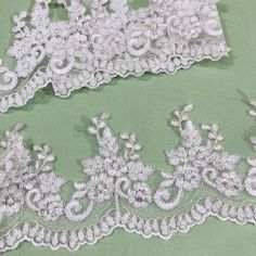 Be mesmerized by the intricate beaded & Corded lace trims featured in our Lace USA line. These luxurious handmade trims bring a touch of elegance and glamour to any look. No matter the occasion, the right trim can make any outfit shine. Choose from our selection of beaded couture lace trims and corded bridal lace trims to make your special day extra sparkly. Whether you prefer corded evening dress lace trim or beaded trim for quinceanera dresses, Lace USA has all your special event needs. For da White Lace Trim For Wedding, Elegant Embroidered White Trims, Elegant White Embroidered Trims, Elegant White Embellished Lace, White Embellished Lace For Wedding, Quinceanera Crown, Corded Lace, Lace Evening Dresses, Beaded Trim