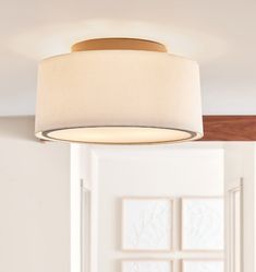 a light fixture hanging from the ceiling in a room