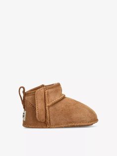 UGG suede and shearling crib boots100% suedeSlips onLow ankle rise, closed round toe, brand patch at back, all-over overlock-stitch detail on seams, soft soleSpecialist leather cleanUpper: 100% suedeLining: 100% shearlingSole: 100% rubber Baby Uggs, Mini Logos, Cribs, Patch Logo, Boots, ? Logo, Leather, Cots