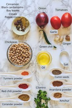 the ingredients needed to make this recipe are displayed on a marble counter top, including tomatoes, onions, garlic, and seasonings