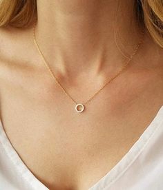 We know you will love the simplicity of our 14k gold filled dainty circle necklace.  This gold piece is as stunning as it is versatile. Wear this piece on its own for your daytime look or layer it with other gold necklaces for a statement-making evening look.  This necklace features a delicate 14k gold filled link chain and a simple open circle pendant design to create a look you will want to wear time and time again. Necklace on model measures 16 inches choose your length from the drop down menu (15" - 18") Circle pendant measures 8mm. Photo #5 - Sterling silver necklace (choose your choice from the drop down menu)  We have the right circle earrings for you to match this beautiful necklace -  https://www.etsy.com/il-en/listing/466244747 This necklace is available also with 14K Gold filled Minimalist Gold Open Circle Necklace, Gold Minimalist Open Circle Necklace, Simple Tiny Charm Necklace, Dainty Circle Necklace With Adjustable Chain, Minimalist 14k Gold Filled Round Necklace, Delicate Chain Open Circle Necklace, Simple 14k Gold-filled Necklace, Simple Charm Necklace With Round Pendant And Delicate Chain, Minimalist Gold Circle Charm Necklace