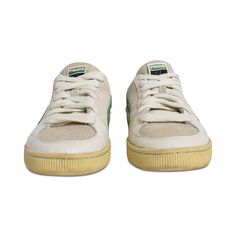 Puma 'Rhuigi' low top sneakers in beige canvas with green suede and leather. Features lace up closure, yellow sole and brown back suede heel. Brand = Puma Condition = 7.5/10, Size = 7/10, good Material = Leather/Suede Condition = 18247-2 Green Suede Lace-up Sneakers, Green Suede Skate Shoes With Gum Sole, Green Suede Lace-up Skate Shoes, Green Lace-up Skate Shoes With Gum Sole, Green Suede Skate Shoes With Round Toe, Green Suede Round Toe Skate Shoes, Green Canvas Sneakers With Contrast Sole, Green Suede Skate Shoes For Streetwear, Green Canvas Lace-up Skate Shoes