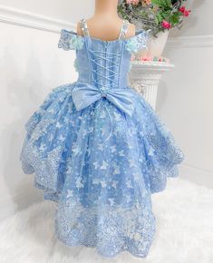 Immerse your child in a world of make-believe with this delightful Cinderella costume. Its magnificent blue hue is designed to ensure your little one stands out, no matter where their adventures take them. Central to this beautiful ensemble is an elegant, zippered corset crafted with comfort and fit in mind. This exceptional feature allows the costume to be adjusted perfectly to your child's figure, providing them with hours of uninterrupted and comfortable playtime. The highlight of this costum Blue Fairytale Princess Dress For Dress-up, Light Blue Fitted Princess Dress For Dress-up, Fitted Fairy Style Princess Dress For Wedding, Blue Princess Ball Gown Dress, Blue Princess Style Ball Gown Dress, Light Blue Princess Dress For Dress-up, Whimsical Blue Dress For Dress-up, Light Blue Princess Dress For Pageant, Princess Style Blue Ball Gown With Ruffles