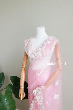 Super beautiful pastel pink net with white embroidery border. It looks heavy but is very easy and light to wear. Suitable for any asian occasion. Includes unstitched blouse which has heavy embroidery.  Please message for more information. White Unstitched Organza Blouse Piece, Wedding Blouse In Organza With Chikankari Embroidery, Wedding Organza Blouse With Chikankari Embroidery, Pink Organza Blouse With Resham Embroidery, Pink Organza Blouse For Wedding, White Organza Blouse Piece With Intricate Embroidery, Pink Embroidered Unstitched Fabric For Reception, Pink Organza Saree With Unstitched Blouse, Pink Embroidered Fabric For Reception Blouse