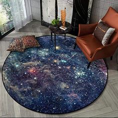 a living room with a large round rug in the shape of a star filled sky