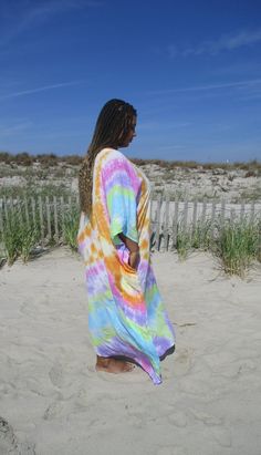 "Maxi Kaftan, Regular or Plus Size, Purple Tie Dye Robe, Boho Maxi Dress, Loose Fitting, Beach Cover-Up, Comfortable Summer Dress, Lounge Wear, Cruise Outfit, Comfy Loungewear Color name: PASTEL RAINBOW aqua-green-wisteria-pink-oj-yellow My gorgeous girlfriend is 36DD-32-44, 5'5\", modeling the regular-size version of this kaftan. This style has NO Sleeves, but depending on your size, it will hang over your arms more or less. This kaftan has a V-neckline, armhole opening on the sides. The fabric Multicolor Short Sleeve Beach Dress, Oversized Multicolor Dresses For Beach Season, Multicolor Short Sleeve Beach Dress For Festival, Multicolor Short Sleeve Dress For Loungewear, Multicolor Short Sleeve Lounge Dress, Multicolor Short Sleeve Loungewear Dress, Oversized Multicolor Beachwear Cover-up, Colorful Short Sleeve Maxi Dress For Beach, Multicolor Long Tunic As Beach Cover-up