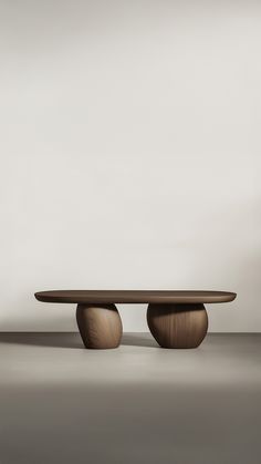 two wooden tables sitting on top of each other in front of a white wall and floor