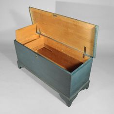 an open chest with two drawers on each side