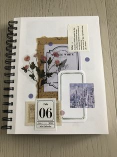 an open notebook with pictures and stickers on it