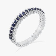 Material: 14k/18k Gold Color Options: Yellow Gold, White Gold, Rose Gold, Platinum ★ StoneBlue Sapphire RoundSize: 1.6 mm * 17Approx Weight (Ct): 0.27★ Band Width: 3.2 mm White Gold Eternity Band With Halo Design, White Gold Sapphire Eternity Band, Sapphire Eternity Band With Vvs Clarity, 14k White Gold Eternity Band With Prong Setting, Round Sapphire Eternity Band With Vvs Clarity, Classic Stackable Round Sapphire Ring, Formal Stackable Round Cut Sapphire Ring, Formal Stackable Sapphire Ring With Round Cut, White Gold Sapphire Stackable Jewelry