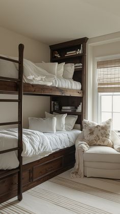 a bunk bed sitting next to a white couch in a living room under a window