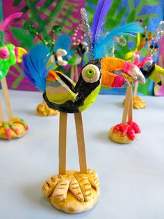 colorful bird figurines sitting on top of a table