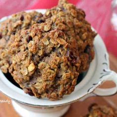 a bowl filled with oatmeal cookies on top of a table