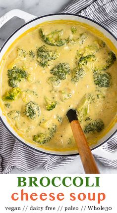 broccoli cheese soup in a pan with a wooden spoon