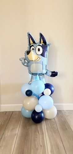 an image of a balloon decoration in the shape of a cat on top of balloons