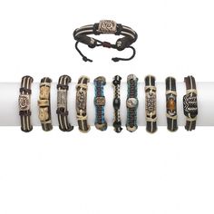 an assortment of bracelets are displayed on a roll