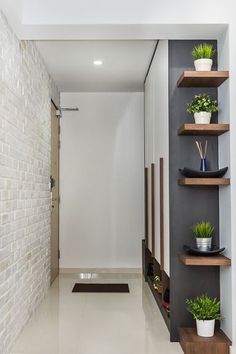 the hallway is clean and ready to be used as a storage area for potted plants