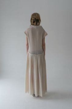 The Yerusalimka Cream Wool Dress combines comfort and sophistication effortlessly. Stitched from breathable wool, this dress is light and airy, making it the perfect choice for both daytime events and evening soirées. The pleating on the skirt adds movement and dimension, creating an elegant silhouette that flatters every figure. Details of raw hemmed lining lend a touch of understated edge, while the high collar offers a timeless look.Composition 100% Italian woolSlightly oversizeModel is 179 cm talland wears M sizeSIZES:SIZE S (European 36)bust: fits bust around 85 -89 cmWaist: fits waist around 68- 73 cmHips: fits hips around 92-95 cmFor overall height: 175 cm aroundSIZE M (European 38)bust: fits bust around 90-94 cmWaist: fits waist around 71-77 cmHips: fits hips around 96-100 cmFor o Blue Flats, Women Helping Women, Wool Dress, Cream Dress, Fast Fashion, High Collar, Wide Leg Pants, Long Dress, Neck Dress