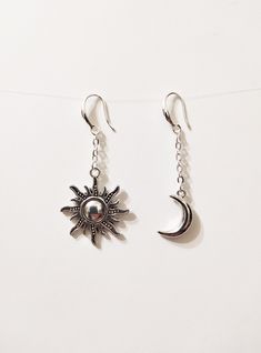 ◆ Earrings with crescent moon and sun these earrings are very beautiful and original the moon represents female entities and consequently fertility, while the sun represents the male entities. The moon measures only 0,629921 inches while the sun 1,06299 inches they are about 2.12598 inches long and are silver plated. ♡ In my shop there are many handmade jewelry for all tastes, come and watch them you are welcome! ♡ ❤ Do you need a custom order? ❤ You can enter a free note to send together with y Celestial Metal Earrings With Sun And Moon Design, Celestial Sun And Moon Metal Earrings, Silver Half Moon Earrings With Sun And Moon Design, Silver Sun And Moon Design Half Moon Earrings, Bohemian Earrings With Sun And Moon Design, Sterling Silver Sun And Moon Dangle Earrings, Symbolic Moon Phase Dangle Earrings, Bohemian Round Earrings With Sun And Moon Design, Sterling Silver Dangle Earrings With Sun And Moon Design