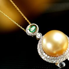 *Condition: Brand new *Center Stone: Natural Golden South Sea Pearl 12mm *Side Stone: Natural White Diamond, Round-cut (VS1 clarity and F color) Natural Emerald from Zambia, Oval Shape *Gold Weight: 9.96g (depend on the ring size) *superior pearls standard - 99% of the pearl surface is clean. An extremely detailed and up-close study of the pearl is needed to find imperfections. Each piece is made-to-order with care and special attention to detail. All items are made with 14 or 18 karat gold and Elegant Gold Emerald Necklace, Luxury Formal Emerald Necklace With Round Pendant, Luxury Round Pendant Emerald Necklace For Formal Occasions, Luxury Yellow Gold Tsavorite Jewelry, Formal Luxury Emerald Necklace With Round Pendant, Luxury Formal Emerald Round Pendant Necklace, Luxury Tsavorite Yellow Gold Jewelry, Luxury Tsavorite Pendant Jewelry, Luxury Tsavorite Necklace For May Birthstone