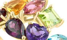 Clustered mixed-cut semiprecious stones bring dazzling color to an elegant 14-karat yellow gold ring. 1/4" ring face Total stone weight: 2.80ct. 14k gold/amethyst/blue topaz/London blue topaz/citrine/garnet/rhodolite/pink tourmaline/peridot Made in the USA Yellow Gold Ring, London Blue Topaz, London Blue, Cluster Ring, Pink Tourmaline, Yellow Gold Rings, Blue Topaz, Semiprecious Stones, Citrine