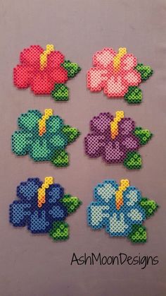 some flowers made out of perler beads are on the screen, and there is an instagramr