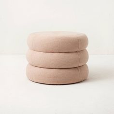 three round cushions stacked on top of each other