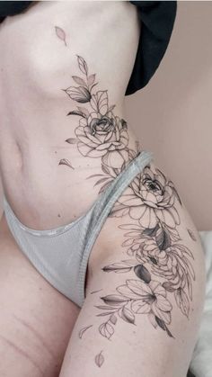 a woman's stomach with flowers on it