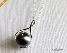 Dark Grey Pearl Drop Sterling Silver Pendant Necklace with .925 Sterling Silver Chain. PLEASE READ ITEM DESCRIPTION and SHOP POLICIES before placing your order, and contact me with any questions! CHAIN is 18 inches (45.7 cm) long. PENDANT is about 0.78 inch (2 cm) long including bail. PEARL is 10mm. NECKLACES SECTION: https://www.etsy.com/shop/LanaChayka?ref=seller-platform-mcnav&section_id=17026331 BRIDAL NECKLACES SECTION: https://www.etsy.com/shop/LanaChayka?ref=seller-platform-mcnav&section_ Bridal Necklaces, Grey Jewelry, Dainty Pendant Necklace, Women Necklaces, Gray Jewelry, Wedding Necklaces, Pearl Bridal Jewelry, Pearl Necklace Wedding, Wedding Pendant