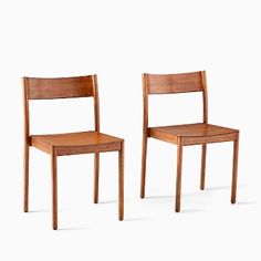 two wooden chairs side by side against a white background