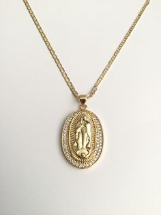 "18K GOLD FILLED GUADALUPE NECKLACE 18\" LONG... FOR GOOD LUCK ,PROSPERITY AND PROTECTION. PENDANT : 30 mm X 20 mm 18K GOLD FILLED CADENA DE GUADALUPE 18\" LARGO .. PARA PROSPERIDAD, BUENA SUERTE Y PROTECCION. DIJE: 30 mm X 20 mm" Yellow Gold Oval Necklace With Our Lady Of Guadalupe, Gold Medallion Necklace With Our Lady Of Guadalupe, Gold Medallion Necklace Of Our Lady Of Guadalupe, Gold Our Lady Of Guadalupe Medallion Necklace, Gold Our Lady Of Guadalupe Necklace Gift, Gold Our Lady Of Guadalupe Necklace In 14k Gold, Spiritual Yellow Gold Our Lady Of Guadalupe Jewelry, Figaro Necklace, Gold Our Lady Of Guadalupe Pendant Necklace