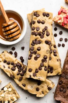 chocolate chip cookie bars and honey on a table