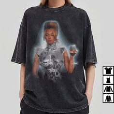 Step back in time and channel your inner diva with our Retro Beyonce Tour Shirt. This iconic piece pays homage Cotton Club Top With Graphic Print, Beyonce Tshirt Outfits, Beyoncé Merch, Beyoncé Shirt, Whitney Houston T Shirt, Nike Cartoon, Beyonce Graphic Tee, Legendary Singers, Cartoon Sweatshirts