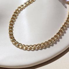 Embody timeless style with our boldest curb chain! The Alexandra Chain is a cult favorite and for good reason. Its ultra versatility makes it easy to wear all day, every day– as a stand-alone statement piece or a layering staple. Choose from luxe 14k gold fill or sterling silver options to elevate any look. DetailsOffered in 14", 16", and 18"Available in 14k Gold Fill and Sterling SilverHypoallergenic, Nickel-Free, and Water Safe Modern Cuban Link Necklace With Adjustable Chain For Everyday, Timeless Chunky Chain Bracelet For Everyday, Timeless Everyday Chunky Chain Bracelet, Minimalist Cuban Link Necklace With Adjustable Chain For Everyday, Minimalist Cuban Link Necklace For Everyday Use, Classic Cuban Link Chain Bracelet For Everyday, Everyday Adjustable Cuban Link Chain Bracelet, Adjustable Cuban Link Chain Bracelet For Everyday, Adjustable Metal Cuban Link Necklace For Everyday