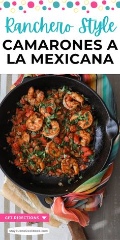 a skillet with shrimp and tomatoes in it on top of a striped table cloth