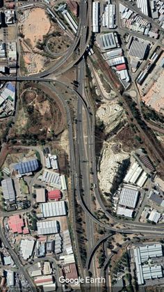 an aerial view of a city with roads and buildings